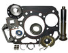 Mechanical parts including a gasket set and various metal components on a white background