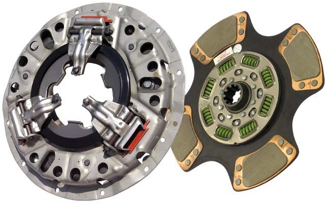 Two clutch plates, one metallic and one with green and gold elements, on a white background.